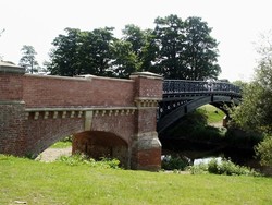 The recently restored 19th century Myton Bridge, viewed from the west bank of the river Swale.