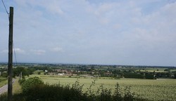 Looking across Brompton village to the plain on which the battle was fought, from the hill to the east of Brompton on the road along which the English army may have approached the field.
